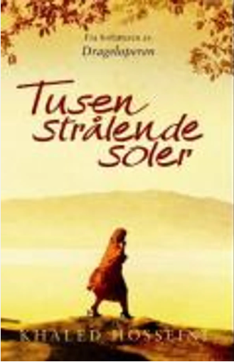 Bok om "Tusen strålende soler" av Schibsted, åpen bokside med tittelen synlig, illustrasjon på forsiden, i naturlig lys.