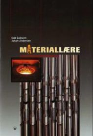 Åpen skolebok i materiallære fra Gyldendal med diagrammer og tekst, brukt til utdanning innen materialvitenskap.