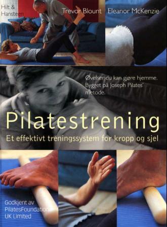 Bok om pilatestrening fra Cappelen Damm AS med fokus på kropp og sinn, innbundet utgave, vises i bildet.