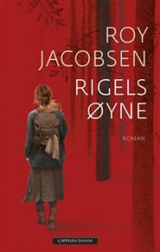 Innbundet roman "Rigels øyne" av Cappelen Damm, bokomslag med tittel og forfatter, synlig i bildet.